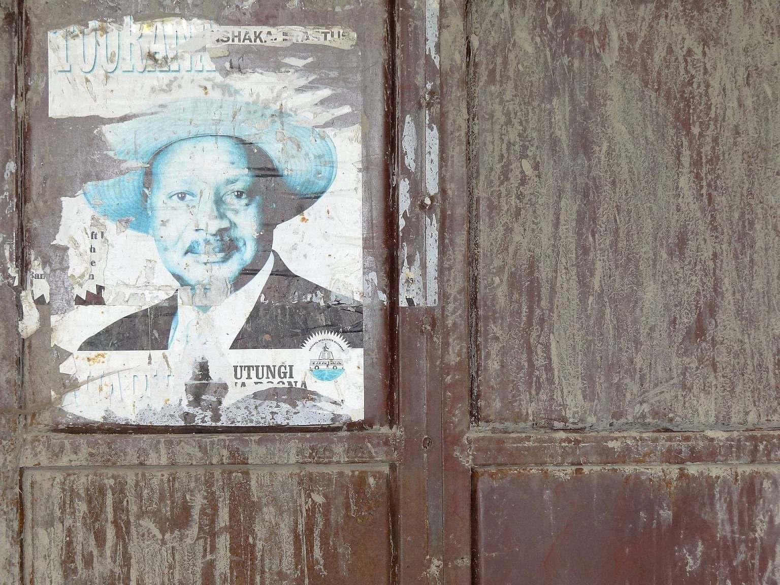 Facade_with_Poster_of_President_Yoweri_Museveni_-_Outside_Kisoro_-_Southwestern_Uganda